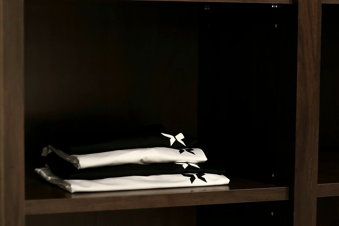 Shapeshift black and white gym tank top for men featuring moisture-wicking fabric, lightweight design, and a tailored athletic fit for intense training sessions.